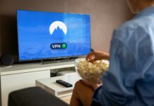 10 lessons from top brands using comments to drive success A relaxed scene at home with a person enjoying popcorn while watching a VPN-protected TV.